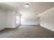 Bright bedroom with grey carpet and access to hallway at 5649 Eagles Watch, Douglasville, GA 30135