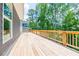 Large deck with wooden railings and a view of the backyard at 5649 Eagles Watch, Douglasville, GA 30135