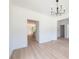 Bright dining room with hardwood floors and modern chandelier at 5649 Eagles Watch, Douglasville, GA 30135