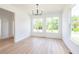 Bright dining room with hardwood floors and large windows at 5649 Eagles Watch, Douglasville, GA 30135