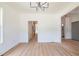 Bright dining room with hardwood floors and modern chandelier at 5649 Eagles Watch, Douglasville, GA 30135