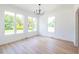 Bright dining room with hardwood floors and large windows at 5649 Eagles Watch, Douglasville, GA 30135