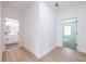 Upstairs hallway showcasing light floors and access to bedrooms and bathroom at 5649 Eagles Watch, Douglasville, GA 30135