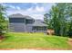 Gray house exterior with deck and wooded backdrop at 5649 Eagles Watch, Douglasville, GA 30135