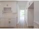 Modern kitchen with white cabinets, quartz countertops, and wine rack at 5649 Eagles Watch, Douglasville, GA 30135