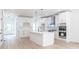 Modern white kitchen with island and stainless steel appliances at 5649 Eagles Watch, Douglasville, GA 30135