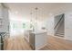 Modern kitchen with island, stainless steel appliances, and white cabinets at 5649 Eagles Watch, Douglasville, GA 30135