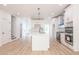 Modern kitchen with island, stainless steel appliances, and white cabinets at 5649 Eagles Watch, Douglasville, GA 30135
