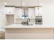Modern kitchen with white cabinets, quartz countertops, and stainless steel appliances at 5649 Eagles Watch, Douglasville, GA 30135