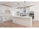 Modern kitchen with island, stainless steel appliances, and white cabinets at 5649 Eagles Watch, Douglasville, GA 30135