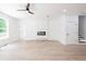 Spacious living area with hardwood floors, fireplace, and access to deck at 5649 Eagles Watch, Douglasville, GA 30135