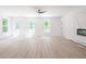 Bright living room featuring hardwood floors and a modern fireplace at 5649 Eagles Watch, Douglasville, GA 30135