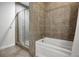 Clean bathroom with a large bathtub and shower at 640 Glen Iris Ne Dr # 303, Atlanta, GA 30308