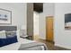 Main bedroom with gray headboard and city views at 640 Glen Iris Ne Dr # 303, Atlanta, GA 30308
