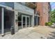 Building entrance with modern glass doors and security system at 640 Glen Iris Ne Dr # 303, Atlanta, GA 30308
