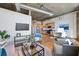Open concept living area with hardwood floors and city views at 640 Glen Iris Ne Dr # 303, Atlanta, GA 30308