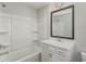 Bathroom with shower/tub combo, vanity, and mirror at 1708 Evenstad Way, Smyrna, GA 30080