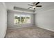 Bright bedroom with large window, ceiling fan and plush carpeting at 1708 Evenstad Way, Smyrna, GA 30080