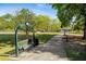 Relaxing park with a shaded bench and walkway at 1708 Evenstad Way, Smyrna, GA 30080
