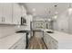 Modern kitchen with white cabinets, quartz countertops, and stainless steel appliances at 1708 Evenstad Way, Smyrna, GA 30080