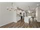 Open kitchen with white cabinets, large island, and hardwood floors at 1708 Evenstad Way, Smyrna, GA 30080