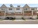 Three-story townhomes with attached garages and private decks at 1708 Evenstad Way, Smyrna, GA 30080