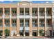 Brick building with multiple balconies and retail spaces at 260 18Th Nw St # 10311, Atlanta, GA 30363