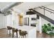 Stylish kitchen boasting white cabinets, quartz countertops, and an island with seating at 260 18Th Nw St # 10311, Atlanta, GA 30363