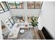 High-ceilinged living room with hardwood floors, city views, and stylish decor at 260 18Th Nw St # 10311, Atlanta, GA 30363