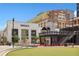 Outdoor plaza with green space, seating, and retail building views at 260 18Th Nw St # 10311, Atlanta, GA 30363
