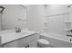 Clean bathroom with shower-tub combination, toilet, and vanity sink with countertop at 313 Foxglove Way, Mcdonough, GA 30253