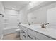 Bathroom featuring double vanity, bath tub, and modern fixtures at 313 Foxglove Way, Mcdonough, GA 30253
