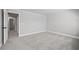 Neutral bedroom featuring gray carpet flooring and a doorway leading to another room at 313 Foxglove Way, Mcdonough, GA 30253