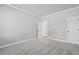 Clean bedroom with neutral carpet, base molding, and white walls and doors at 313 Foxglove Way, Mcdonough, GA 30253