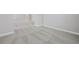 An open bedroom with light gray walls, neutral carpet, and white trim at 313 Foxglove Way, Mcdonough, GA 30253