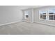 A bedroom with two windows that allow natural light to enter at 313 Foxglove Way, Mcdonough, GA 30253