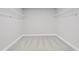 Walk-in closet featuring neutral carpeting and wire shelving at 313 Foxglove Way, Mcdonough, GA 30253