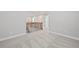 Hallway featuring wood and metal railing with gray carpet flooring and white base trim at 313 Foxglove Way, Mcdonough, GA 30253