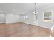 Spacious living room with wood floors, ample natural light, and a view of the backyard at 313 Foxglove Way, Mcdonough, GA 30253