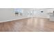 Open living space featuring wood floors, plenty of natural light, and a view of the outdoors at 313 Foxglove Way, Mcdonough, GA 30253
