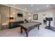 Finished basement with pool table, wet bar, and herringbone floors at 9680 Almaviva Dr, Alpharetta, GA 30022