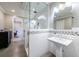 Bathroom with a pedestal sink and glass shower at 9680 Almaviva Dr, Alpharetta, GA 30022