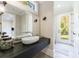Contemporary powder room with floating vanity, oval sink, and exterior access at 9680 Almaviva Dr, Alpharetta, GA 30022