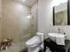 Modern bathroom with a walk-in shower, toilet, and vessel sink at 9680 Almaviva Dr, Alpharetta, GA 30022