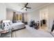 Spacious bedroom with a desk and window views at 9680 Almaviva Dr, Alpharetta, GA 30022