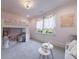 Charming bedroom features a built-in bunk bed, a cozy sitting area, and plenty of natural light at 9680 Almaviva Dr, Alpharetta, GA 30022