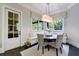 Charming breakfast nook with a built-in banquette and window seating at 9680 Almaviva Dr, Alpharetta, GA 30022