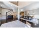 Two-story entryway with grand staircase and view to dining room at 9680 Almaviva Dr, Alpharetta, GA 30022