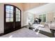 Bright entryway with view to living room and grand staircase at 9680 Almaviva Dr, Alpharetta, GA 30022