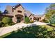 Brick home with landscaped yard and driveway at 9680 Almaviva Dr, Alpharetta, GA 30022